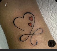 a tattoo with two hearts on it