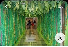 the hallway is decorated with green streamers and leaves