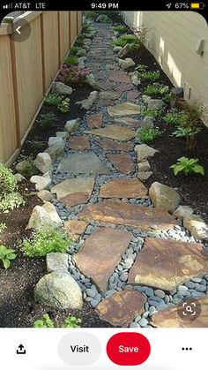 a stone path in the middle of a yard