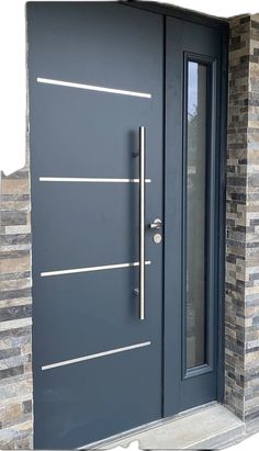 the front door is painted dark gray and has two sidelights on each side, along with a brick wall