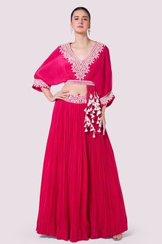 Buy pink embellished baggy sleeves top online in USA with skirt. Shop the best and latest designs in embroidered sarees, designer sarees, Anarkali suit, lehengas, sharara suits for weddings and special occasions from Pure Elegance Indian fashion store in USA.-full view Pink Embellished Blouse With Traditional Drape, Bollywood Style Embellished Pink Palazzo Set, Pink Bollywood Style Embellished Palazzo Set, Pink Top With Traditional Drape For Parties, Pink Traditional Drape Top For Party, Festive Pink Georgette Top, Embellished Pink Blouse For Reception, Embellished Pink Georgette Palazzo Set, Pink Long Skirt Sharara For Navratri