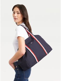 Tommy Hilfiger women's bag. Our sporty bag features comfortable carry handles for easy toting. Styled in sturdy fabric that's durable enough to take anything you throw at it (or in it).  Material: 100% Cotton. Tommy Hilfiger Store, Women's Shoes Accessories, Flag Logo, Zip Tote, Tommy Hilfiger Women, Bag Bag, Tommy Jeans, Women's Bag, Duffle Bag