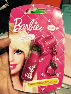 a barbie hair dryer and keychain are in the package for someone to buy