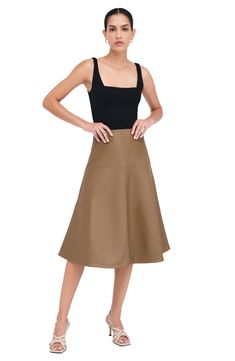 Glossy faux leather and architectural seaming add a modern mood to the classic A-line skirt. Hidden side-zip closure 93% polyester, 7% spandex Machine wash, line dry Imported Vegan Leather Midi Skirt, Leather A Line Skirt, Vegan Leather Skirt, Leather Midi Skirt, The A Team, Dressed Down, A Line Skirt, Italian Leather, A Line Skirts