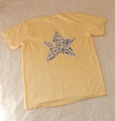 Star Patch Yellow Tee by Asho Designs available only at ashodesigns.com! Yellow, tshirt, tee, cute tee, cute t-shirt, t-shirt outfit, unique t-shirt, summer t-shirt, spring t-shirt, bold t-shirt, quilt, quilt clothes, quilt shirt, handmade clothes, cute outfit, star, berry pattern, floral pattern clothes, clothes, leisure wear, comfy cute outfit, girly style, girly tshirt, preppy tshirt, country style, coquette, coquette aesthetic, sewing aesthetic, free people style, boho style, free people clothes, free people tshirt, beachwear, beach outfit, summer outfit, spring outfit, hand sewn, handmade, patch tshirt, pattern patch clothes, beach girl, coastal outfit, summer 24 outfit, spring 24 outfit, spring style, summer style Summer Cotton T-shirt With Star Patch, Cotton T-shirt With Star Patch For Summer, Aesthetic Sewing, Girly Tshirt, Patch Tshirt, Sewing Aesthetic, Berry Pattern, Quilt Shirt, Quilted Clothes