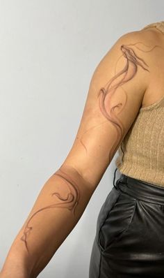 a woman with a tattoo on her arm