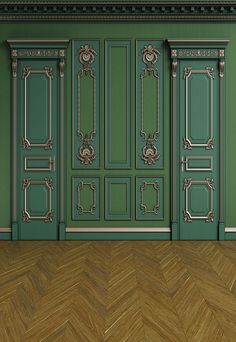 an empty room with wooden floors and green doors on the wall, in front of a chevron parquet floor