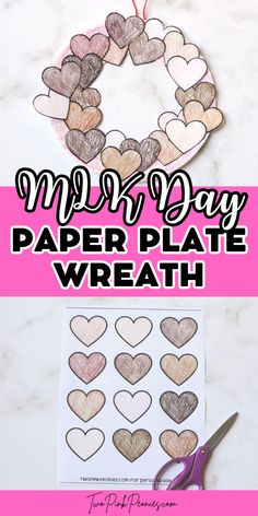 valentine's day paper plate wreath with hearts cut out on it and scissors next to it