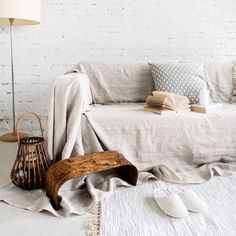 a living room with a white brick wall