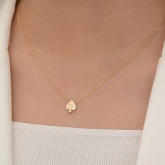 Enhance your style with our Ace of Spades Poker Necklace, a sleek testament to craftsmanship in 18k solid gold.  Spades  size: 8mm* 8 mm  chain length: about  42 centimeters Material: 14k solid gold and also 10k and 18k gold Style: Minimalism This handcrafted pendant embodies luxury and the allure of good fortune, making it a perfect accessory for both casual and formal attire. Simple, elegant, and imbued with the spirit of the game, it's an ideal piece for poker lovers and fashion aficionados alike.  this Spades Pendant Necklace is not just a symbol of luck but also a testament to unparalleled craftsmanship. The iconic emblem of strategy and success, polished to a gleaming finish. Designed for the discerning individual, this luxurious accessory embodies a blend of classic elegance and con Spade Necklace, Ace Of Spades, Luxury Necklace, Simple Elegant, Formal Attire, Necklace Handmade, Classic Elegance, Gold Style, Chain Length