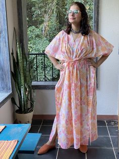 I made this caftan dress from a beautiful ombre watercolor pattern and is available in many colors. I used the softest mulmul cotton fabric to make this. It is extremely soft and it gets softer with every wash. It is so free flowing, that it will make you feel as if you aren't wearing anything at all ;) The beauty of the Kaftans is they will fit everyone so no need to worry about the size et all. All my Kaftans have deep necks(11-12 inches) so will fit all head sizes. However, the length of my k Long Batik Print Kaftan For Spring, Tie Dye Flowy Kaftan For Beachwear, Long Spring Kaftan With Batik Print, Flowy Tie Dye Kaftan For Beachwear, Long Kaftan With Batik Print For Spring, Summer Dress With Batik Print And Kimono Sleeves, Spring V-neck Kaftan With Batik Print, Spring Tie Dye Maxi Kaftan, Tie Dye Kaftan For Spring Beachwear