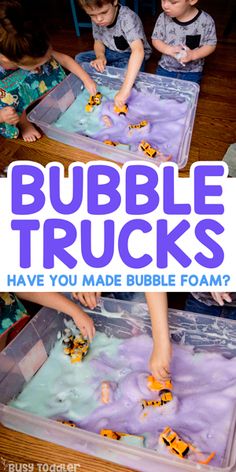 two children playing with bubble trucks in a plastic container on the floor and text overlay that reads, bubbles trucks have you made bubble foam?