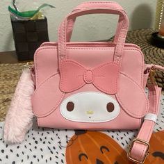 The Cutest Thing Ever Statement Bags Just Dropped Sanrio Originals! Get Yours Today! Awesome Quality Fits My Phone (Iphone 12 Pro Max), Keys And Mini Card Wallet With A Mascara And 2 Lipsticks Cute Pink Satchel Bag, Pink Handheld Satchel, Pink Handheld Portable Satchel, Pink Kawaii Handheld Bag, Cute Satchel With Adjustable Strap For Daily Use, Cute Satchel Shoulder Bag With Adjustable Strap, Pink Portable Rectangular Shoulder Bag, Cute Satchel For Everyday Use, Portable Pink Satchel For Daily Use