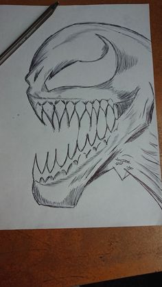 a drawing of a dinosaur's head with sharp teeth