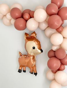 an image of a balloon decoration for a baby's first birthday with balloons in the shape of a deer