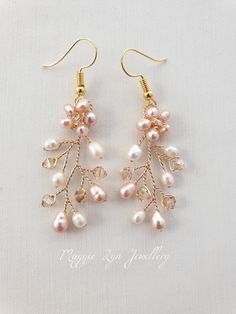 Truly beautiful bridal earrings, handmade with quality natural freshwater pearls in blush and ivory with champagne quality crystals set on a Gilt gold plated wire showing intricate detailing.   The earrings have a drop of approximately 4.5cm Please see our other items for the matching accessories shown, this listing is for the earrings only. All of our items are made to order so adjustments can be made with regards to materials and designs. Please message us if you require different specificatio Pearl Dangle Earrings For Bridesmaid Gift, Dangle Pearl Earrings For Bridesmaid Gift, Pearl Beaded Drop Earrings For Wedding, Wedding Pearl Drop Beaded Earrings, Pearl White Beaded Earrings For Wedding, Handmade Rose Gold Bridal Earrings For Wedding, Pearl Beaded Dangle Earrings For Wedding, Handmade Rose Gold Pearl Earrings For Wedding, Elegant Pearl Beaded Earrings With Ear Wire