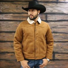 This Mens Suede Trucker Jacket mixes the old west with contemporary fashion. Made out of faux suede, this full-zip jacket has a snap front storm flap. Two side-entry pockets give it that authentic Western look. Throw this jacket on over anything and for warmth and an authentic western look. Zipper and snap closure Adjustable snap sleeves Soft faux sherpa lining and collar Mens Western Jackets, Western Jackets, Suede Trucker Jacket, Suede Jacket Men, The Old West, Contemporary Wardrobe, Western Jacket, Western Look, Sherpa Jacket