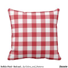 a red and white checkered pillow on a white background