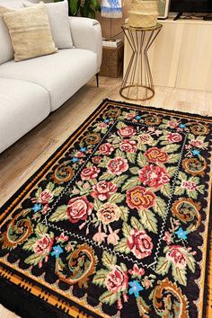 a living room filled with furniture and a rug