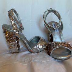 These Are Virtually Brand New, I Wore Them Around The House Trying To Get Used To Them. I’m Not Sure How The Discoloration In The Bottom Of One Happened As I Didn’t Wear Them Very Long/Often. Gorgeous Sequined Steve Madden Heels, Size 6.5. The Sequins Can Be Flipped To Either Silver Or A Golden Shade As Shown. Sequins Everywhere! Offers Welcome! Get Your Perfect New Year’s Eve Shoes! Silver Round Toe Wedding Shoes For Party, Formal Block Heel With Sequins, Formal Sequined Block Heels, Silver Wedding Shoes For Party Season, Silver Wedding Shoes For Evening Parties, Silver Heels For Prom And Party Season, Glamorous Silver Block Heel Wedding Shoes, Metallic Silver Open Toe Heels For Party, Metallic Silver Open Toe Party Heels