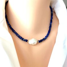 "Fabulous Lapis Lazuli faceted cube shape beads enhanced with a freshwater baroque pearl and Gold filled details and lobster claw closure. This necklace can make a perfect gift for December birthday ladies. MATERIALS: Faceted Labis lazuli square beads 4mm Freshwater baroque pearl Gold filled details and closure Measures 16\"inches approx. 41cm plus 5cm chain extender All Loulia Pearl Jewelry orders are carefully packaged in a jewelry box with foam insert and secured with a ribbon for safe delive December Birthstone Necklace, Cube Shape, December Birthday, Square Beads, Lapis Lazuli Necklace, Lapis Lazuli Beads, Hematite Stone, Chain Extenders, Square Bead