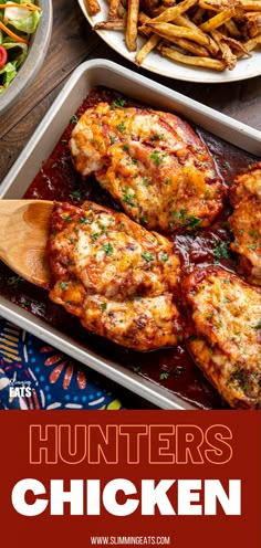 an image of some chicken in a pan with sauce and french fries on the side