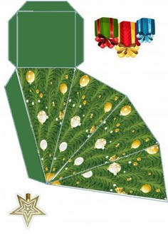 an origami card with green leaves and gold balls on it, next to a star