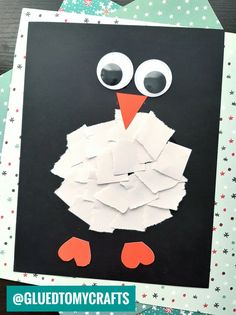 a penguin made out of paper and some scissors