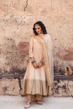 It comes with a 3 piece set. It comes with flared anarkali comes with 3/4th sleeves, round neck teamed solid cotton pants and an organza dupatta. The sleeves as beautiful zardozi, kasab and dabka detailing done. Fabric-Cotton Color-Beige Dupatta Fabric-Organza Anarkali Length-40 inches Pant Length-38 inches Work-zardozi, kasab and dabka detailing done. Neck-Round Sleeves-3/4th Sleeves Modal is 5'8 tall wearing size small. Washing Instructions-Dry Clean Gulabo Jaipur, Cotton Anarkali Suits, Cotton Anarkali, Embroidered Anarkali, Embroidered Pants, Organza Dupatta, Anarkali Suit, Cotton Pyjamas, Suit Set