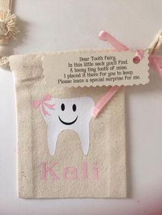 a small bag with a tooth on it