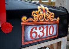 a close up of a mailbox with the number 5310 painted on it's side