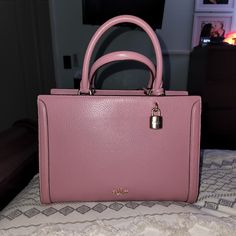 Never Used Purse. Elegant Pink Bag With Double Handles, Elegant Pink Tote Bag, Elegant Pink Office Bags, Elegant Pink Top Handle Satchel, Pink Satchel With Gold-tone Hardware For Office, Pink Office Satchel With Gold-tone Hardware, Luxury Coach Bags With Top Handle, Luxury Coach Top Handle Bag, Luxury Coach Bag With Double Handle