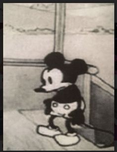 the mickey mouse and minnie mouse are standing next to each other