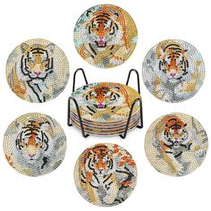 six tiger coasters with metal stand and four plates on each side, all decorated in different colors