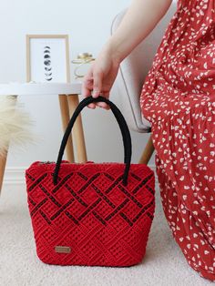 Add a pop of vibrant color to your wardrobe with this unique purse. This striking red shopper adorned with black beads is perfect for those who love to stand out. Crafted from durable polyester cord, the high-quality beads and leather backing ensure the bag maintains its shape and style for years to come. The silver lock adds a touch of elegance, while the fabric lining provides practicality. Whether you're treating yourself or looking for a great gift, this bold, colourful accessory is a must-h Red Crochet Tote Bag For Everyday, Red Crochet Tote Bag For Daily Use, Red Rectangular Crochet Bag For Everyday Use, Everyday Red Rectangular Crochet Bag, Red Crochet Tote Bag, Red Square Crochet Bag For Everyday, Rectangular Red Crochet Bag For Daily Use, Rectangular Red Crochet Bag For Everyday Use, Handmade Red Shoulder Bag For Travel