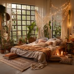 a large bed sitting in a bedroom next to a window filled with potted plants