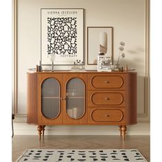 a wooden cabinet with glass doors and drawers in a living room next to a rug