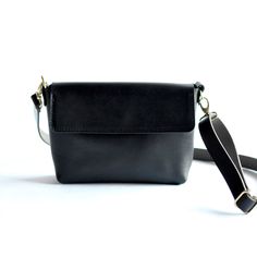 We have nothing but love for this bag! Harlow transforms seamlessly from clutch to a hands-free bag with strap. With an adjustable strap, you can transition from crossbody to a shoulder bag and any length between.Black LeatherBlack Leather StrapBrass Hardware ... • Fast & FREE Shipping on orders over $150• Made with a single piece of Full-Grain leather• Magnetic snap closure• Open interior pocket• Measurements: 10.5" wide across top, 9” wide across bottom, 6.5" high, 2.5" deep• Removable adjusta Hands Free Bag, Nothing But Love, Crossbody Clutch, Free Bag, Single Piece, Full Grain Leather, Hands Free, Snap Closure, Wallets