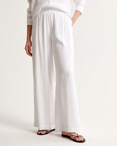 Elevate your wardrobe with the Abercrombie & Fitch Women's Crinkle Textured Pull-On Pants. These ultra high-rise, wide-leg pants are the epitome of comfort and style, crafted in a breezy, crinkle-textured fabric that flows with every step.

- Size: XXXL LONG
- Color: White
- Material: Body - Viscose, Nylon; Lining - Viscose
- Gender: Female
- Style: Pull-on with an elasticated waistband for easy wear and adjustability

Perfect for a relaxed day out or a chic office look, these pants promise vers High Rise Wide Leg Pants, Pants Design, Viscose Fabric, Textured Fabric, Pull On Pants, Easy Wear, Leg Pants, Wide Leg Pants, Chic Style