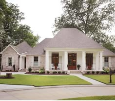 a white house with red doors and windows