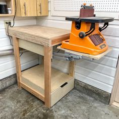 a workbench with an electric sander on it