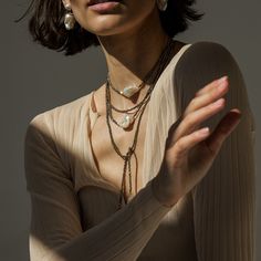 Our sparkling double-layered pyrite necklace is designed to uplift and inspire. Crafted from delicate golden-hued pyrite gemstones, lustrous one-of-a-kind baroque pearls, and set into 14K gold-filled metal, this necklace won't fade, tarnish, or cause irritation. You'll find yourself smiling, laughing, and moving more freely when you wear our baroque pearl necklace, perfect for any occasion, day or night. Wear it alone or layer it with our matching Long Pearl Baroque Pearl Pyrite Necklace for a b Elegant Double Strand Necklaces With Unique Variations, Elegant Brass Necklace With Unique Variations, Elegant Brass Necklaces With Unique Variations, Elegant Brass Necklaces For Layering, Gold Double Strand Jewelry With Natural Stones, Elegant Multi-strand Brass Jewelry, Elegant Brass Jewelry For Layering, Elegant Bronze Necklace With Unique Variations, Elegant Bronze Necklace With Unique Design