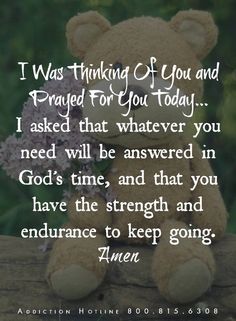 a teddy bear sitting on top of a wooden fence with flowers in its lap and the words i was thinking of you and praying for you today