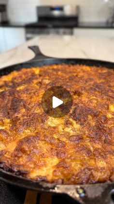 a pan filled with food sitting on top of a stove