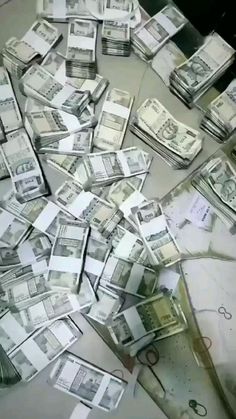 a pile of money sitting on top of a table