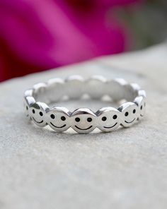 Sterling Silver Happy Face Ring | The Life Divine This beautiful ring encircles your finger with Smiley Faces! These Happy Faces are sure to bring a smile : ) Measures approximately 1/8" H Smiley Face Round Jewelry For Friendship, Round Smiley Face Jewelry For Friendship, Adjustable Stackable Circle Rings As Gift, Cute Adjustable Hypoallergenic Rings, Smiley Face Ring As Gift, Purity Ring, Infinity Band, Face Ring, Happy Faces