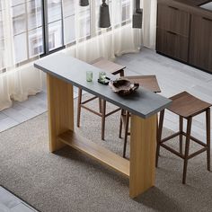 a dining table with two stools in front of it