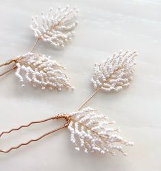 Introducing our Bridal Leaf Hair Pins - a special touch of elegance for your wedding day. Each hairpin is lovingly crafted by hand, ensuring it's one-of-a-kind for your big day. With a charming leaf-inspired design adorned with pristine white beads, they add a timeless and enchanting quality to your bridal look. Whether you choose an intricate updo or loose, flowing locks, these hairpins effortlessly enhance your bridal hairstyle. They are versatile and suitable for various looks. Looking for a Beaded Bridal Jewelry, Bohemian Bridal Hair, Boho Bridal Headpiece, Headpiece Wedding Hair, Hair Comb Accessories, Bohemian Bridal, Bridal Hairstyle, Wedding Hair Pins, Bridal Headpiece