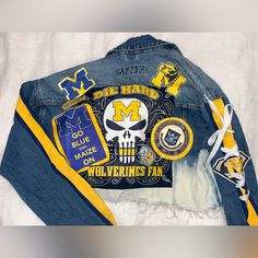 Custom Michigan Jean Jacket; Never Worn! Mom Jeans Football Game, Upcycle Jean Jacket, Gameday Fashion, College Gameday Outfits, Bedazzled Jeans, Fitted Jean Jacket, Gameday Outfits, Custom Jean Jacket, College Gameday