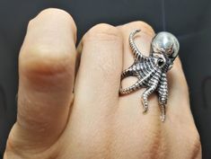 Octopus Kraken Ring Pure 925 Sterling Silver Octopus Ring This beautiful OCTOPUS Ring is handmade and has been Fabulously casted with 925 Sterling Silver The weight of the ring is 12.8-13.5 Grams depending on size The Length of the Octopus is 40 millimeters (from the lower tentacles to the upper tentacles). The Width of the Octopus is 23 millimeters. Please allow 2-3 weeks shipping as we are in Bangkok Thailand at this time *please inquire if you don't see your size listed here* *please inquire Themed Silver Ring Jewelry, Novelty Silver Ring Jewelry, Silver Claw Rings For Gift, Octopus Engagement Ring, Octopus Ring Holder, Beautiful Octopus, Ringed Octopus, Blue Ring Octopus, Octopus Brooch